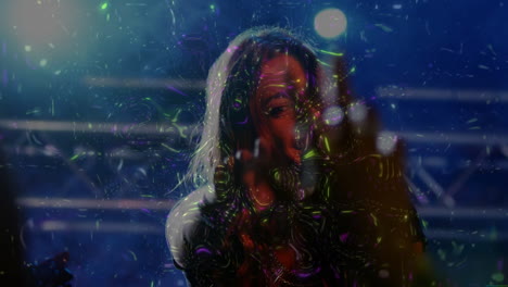 female duo singing on music stage, holding microphone in psychedelic lights and holographic effects