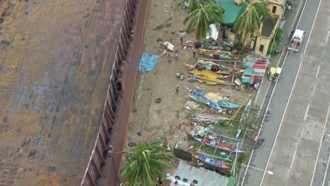 aerial view of huge ship stuck on the seashore after typhoon rolly hit puerto galera, philippines