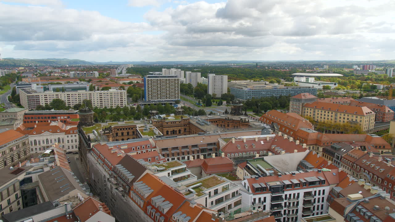 Aerial View of Dresden Sachsen Germany from the top of Frauenkirche with Historic and Modern Architecture, Red-Roofed Buildings, Residential Blocks, and Greenery, cloudy sky