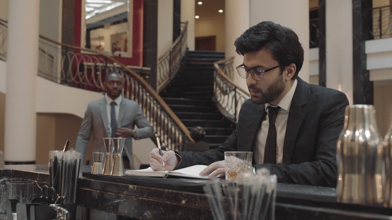 Business Partners Meeting by Bar Counter