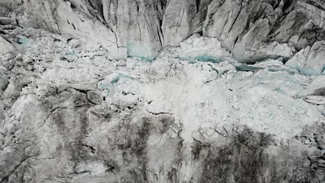 aerial view over the moiry glacier near grimentz in valais, switzerland with a top down view of the icy crevasses