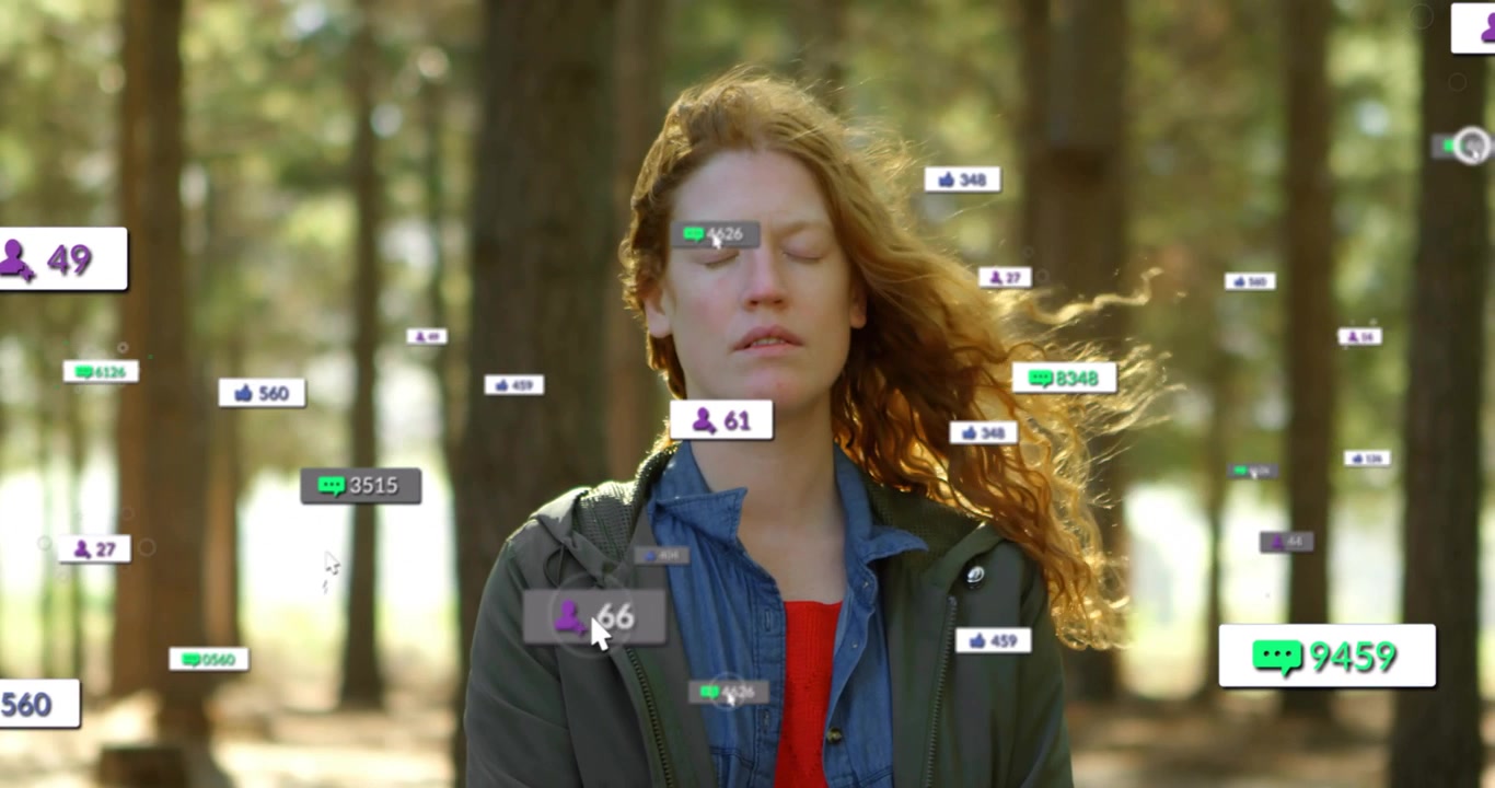 Woman facing camera in woods cursor hovering causing social badges around her for likes then fading