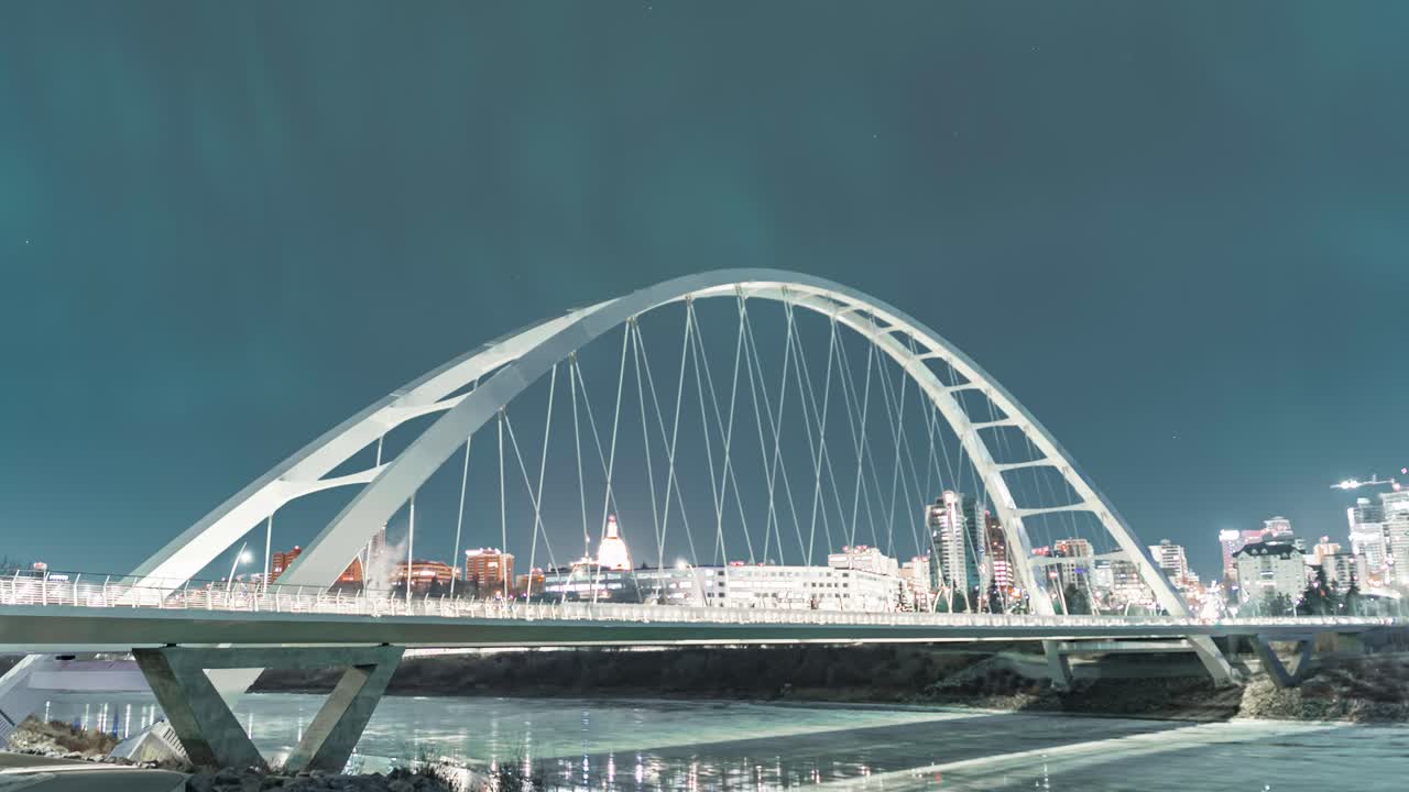 A rare time lapse of flickering green northern lights over Edmonton, Alberta's Walterdale Bridge