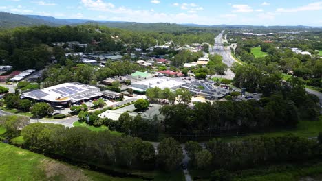 reversing aerial over mudgeeraba market shopping centre, gold coast, queensland, australia