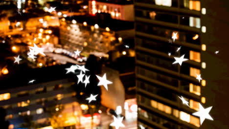 animation of falling white stars over cityscape