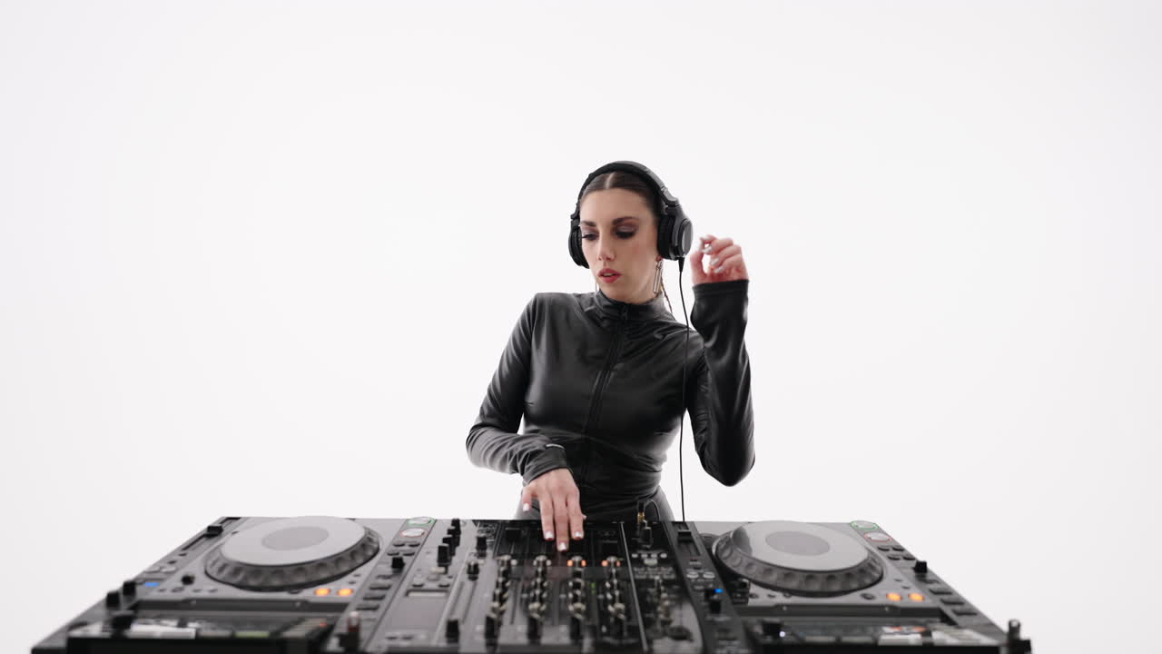 Woman dj performing at a music festival