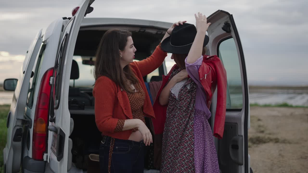 Two Friends Getting Ready for a Trip in a Van
