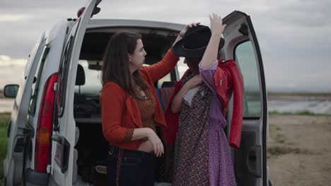 two friends getting ready for a trip in a van