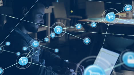 animation of network of connections with icons over caucasian businessman using laptop