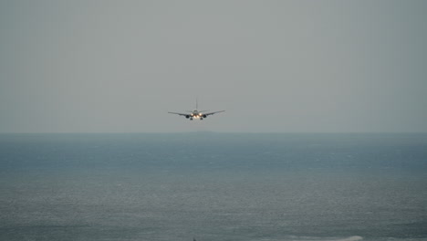 The-plane-lands-at-the-airport-on-the-ocean