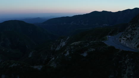 Drone-shot-traversing-over-the-mountains-in-Angeles-National-Forest-at-Sunset