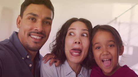 Animation-of-bokeh-over-happy-biracial-family-making-funny-faces