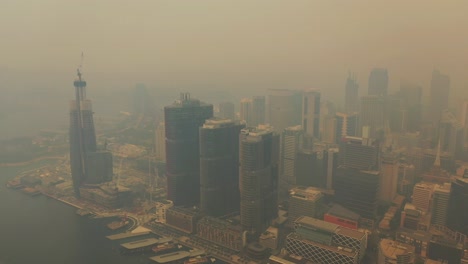 sydney covered in smoke - darling harbour flight during the bush fires