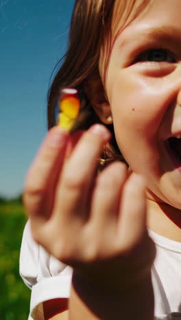 child playing with a butterfly