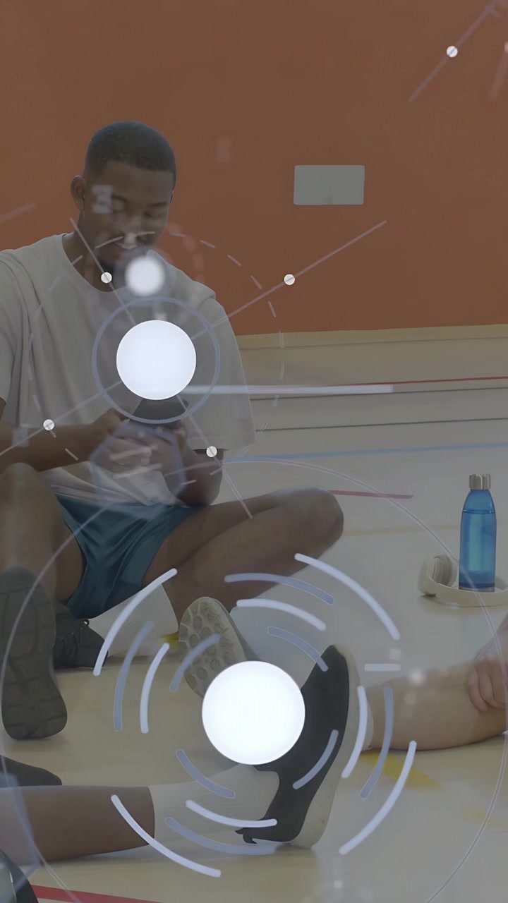 Vertical video: Center man pulling phone and tapping screen on court, HUD showing sports stats
