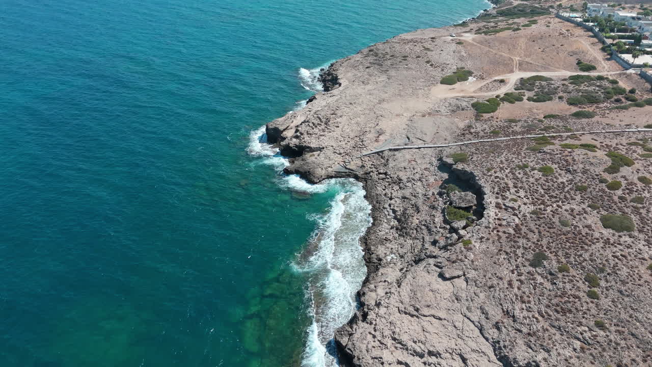 The rocky north cyprus coast with turquoise waters and rugged landscape, aerial view