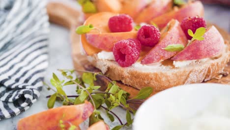 peach ricotta toasts garnished with walnuts, fresh mint,