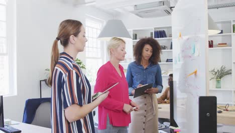 colleagues working with a board
