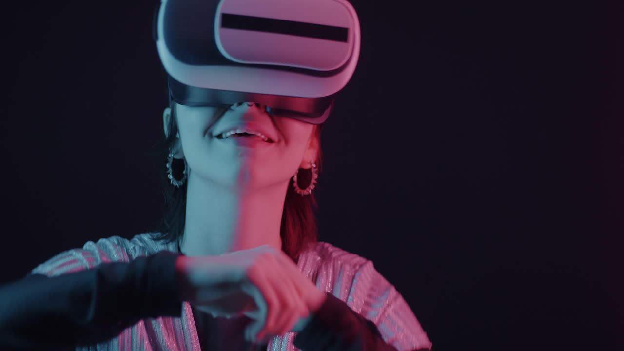 Person Experiencing VR Technology in Neon Lighting