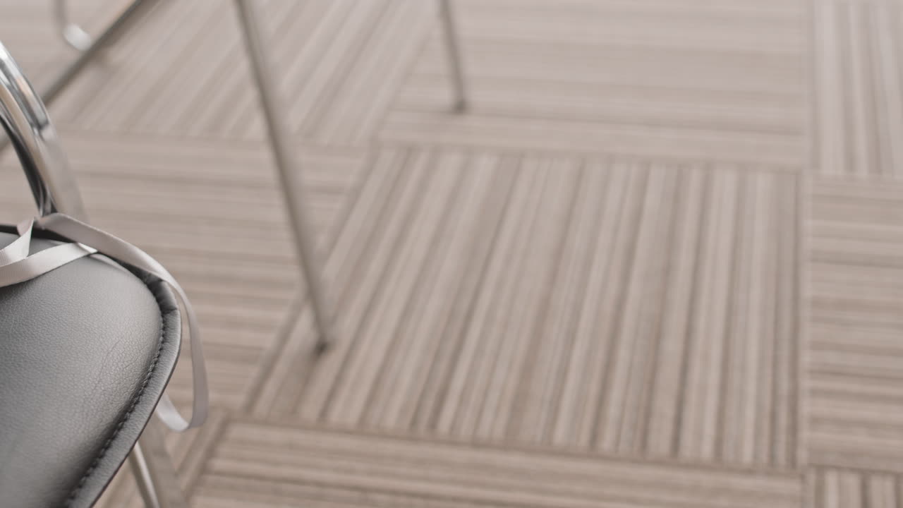 Close-up of a chair with a notebook and badge