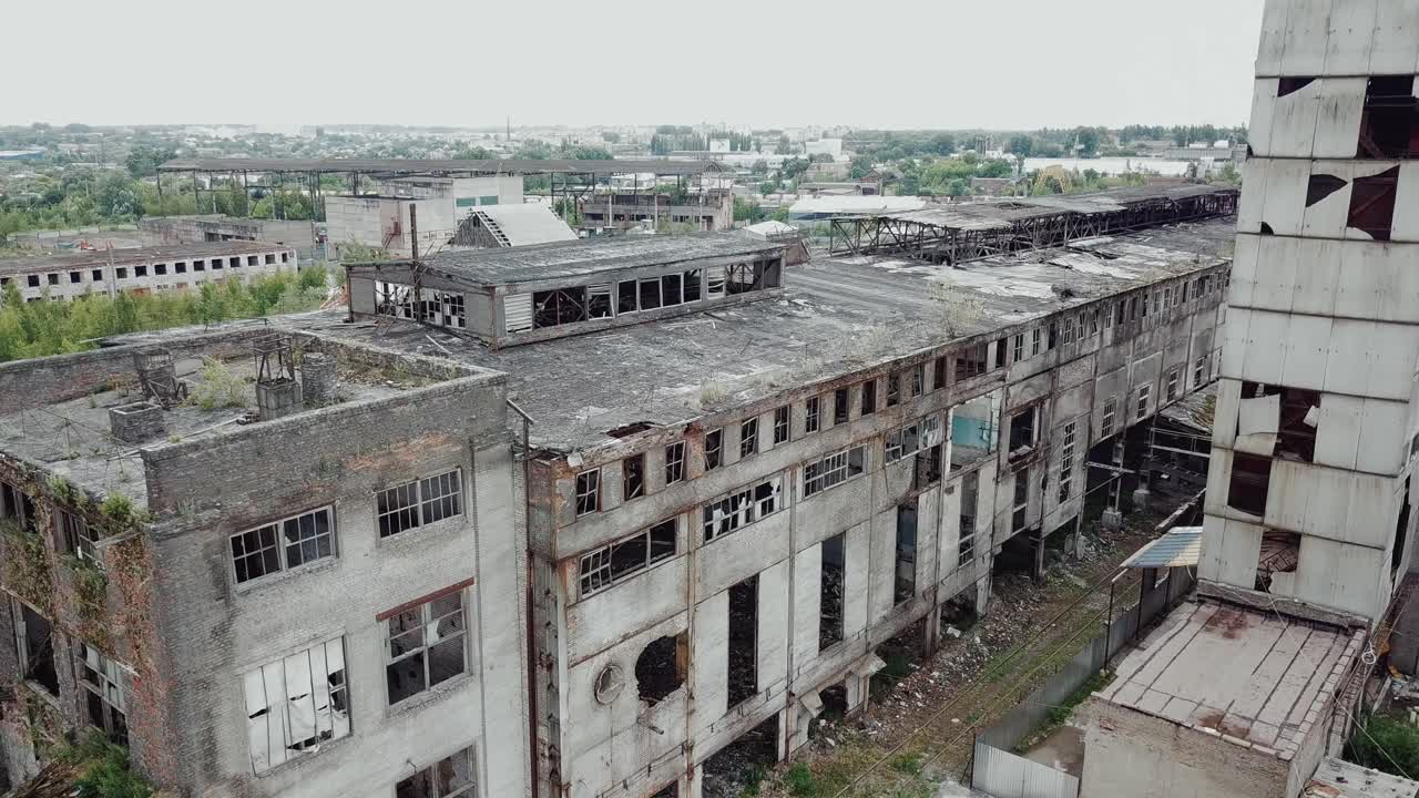 Flight over the destroyed factory. Old industrial building for demolition. Aerial view