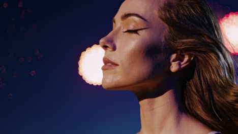 woman gazing skyward, experiencing profound wonder during spectacular fireworks display, silhouetted against luminous night sky, capturing serene moment of awe and breathtaking beauty