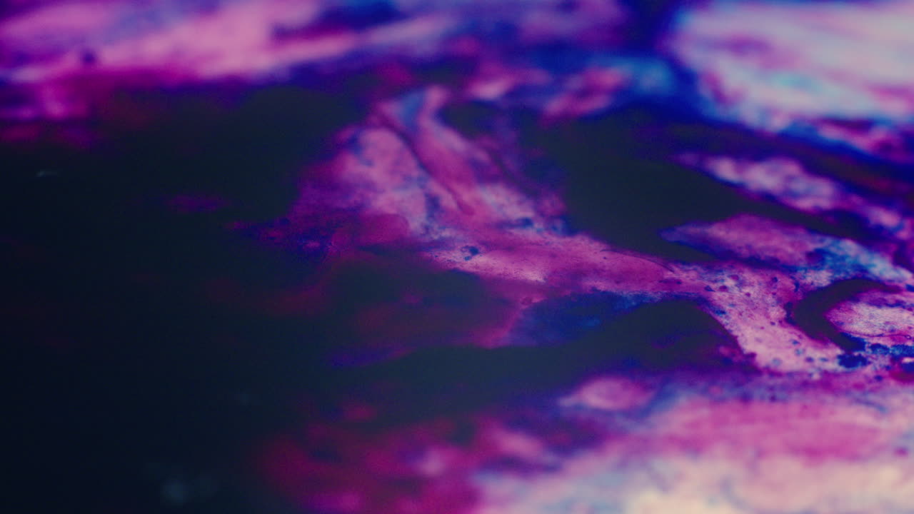 Colourful, organic, liquids macro shots buzzing and flowing