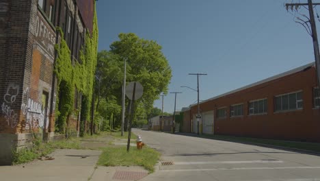 moving slow motion footage of abandoned building with moss and graffiti located in cleveland ohio