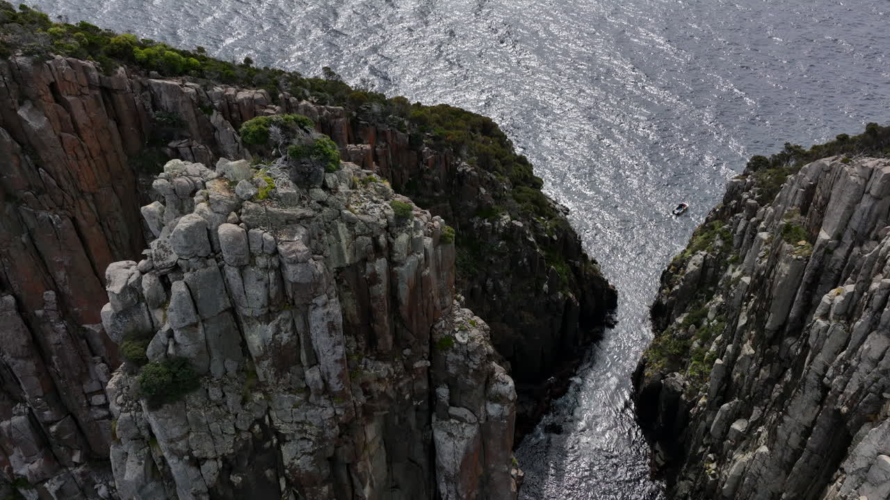 Aerial: Coast of Tasmania with giant cliffs