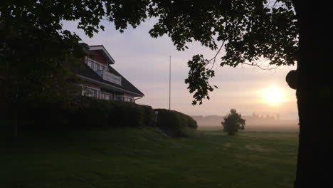 typical scandinavian residential home exterior and garden on a summer morning