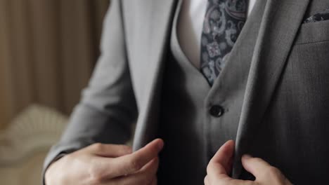 Handsome-groom-businessman-wearing-gray-jacket-at-home-in-living-room,-white-shirt-with-black-tie