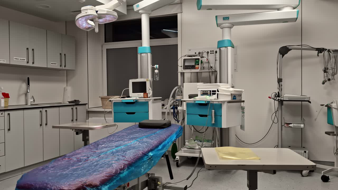 Clean surgical room with equipment, ready for medical procedures