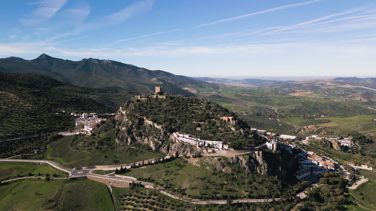 Aerial drone pushes in towards the Zahara de la Sierra Castle.