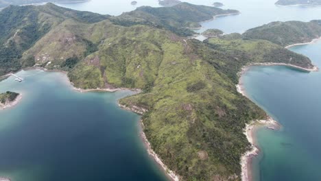 Hong-Kong-Island-landscape-with-green-hills,-unique-sand-strips-and-hidden-bays,-Aerial-view