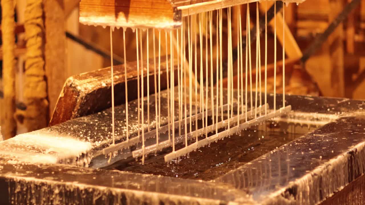 Hand-dipping candles in wax at Sovereign Hill