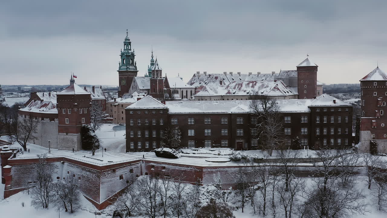 Panorama of snow-covered Wawel castle at cloudy morning, Krakow, Poland