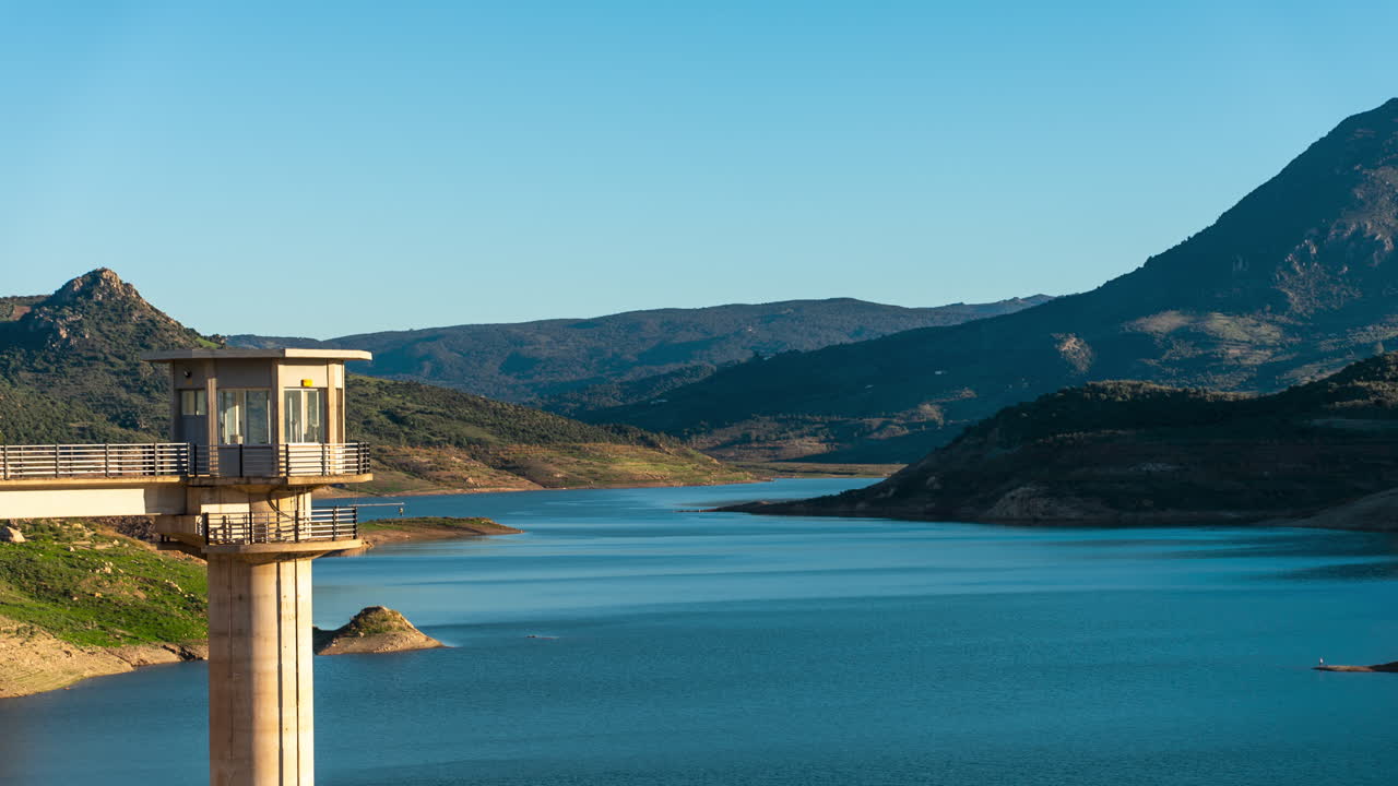 Time lapse, observation dock overlooking the beautiful Zahara-El Gastor Reservoir in Southern Spain.