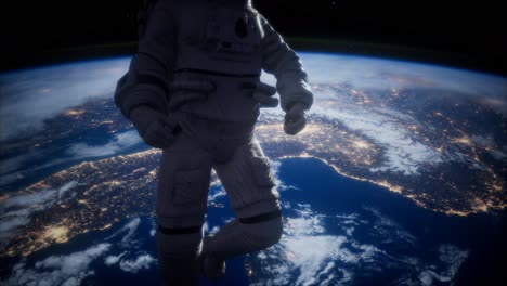 astronauta en el espacio exterior contra el telón de fondo del planeta tierra
