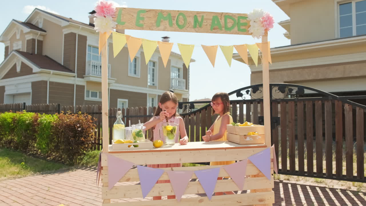 10-Year-Old Sisters At Lemonade Market
