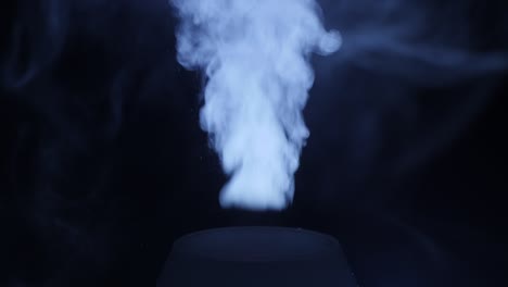 working a humidifier with a blue circular light