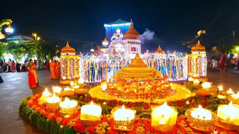 a stunning hindu temple illuminated with lights and candles