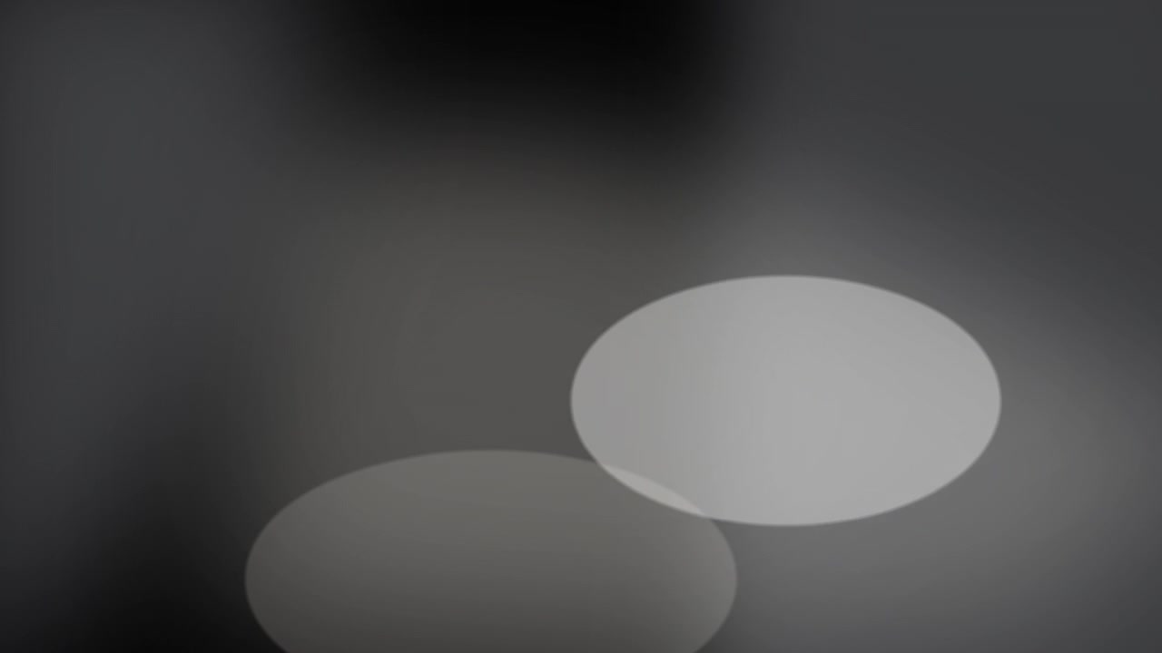 Abstract Motion of Glowing Light Orbs on Dark Background
