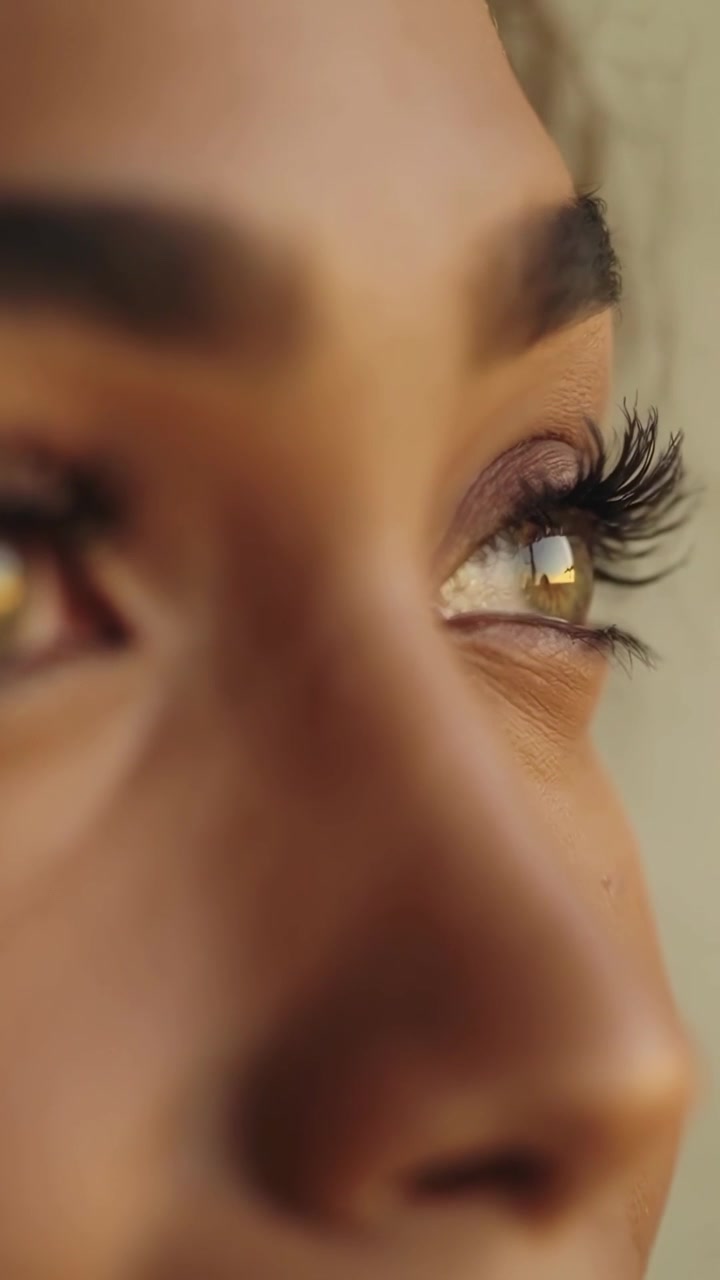 Close-up of a Woman's Eyes with Sunset Reflection