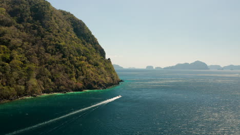 aerial showing speed boat in el nido, palawan, philippines