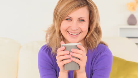 Blondhaired-woman-drinking-coffee