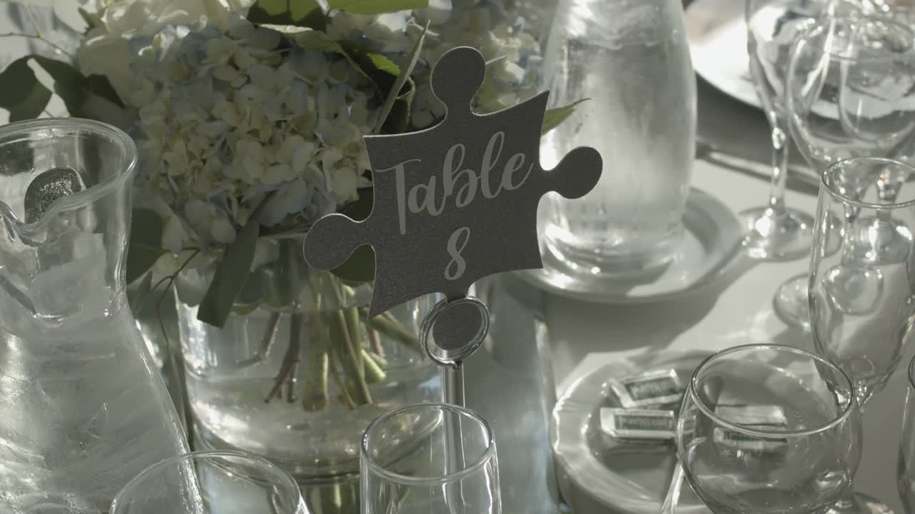 Prepared table with glasses and flowers for wedding ceremony