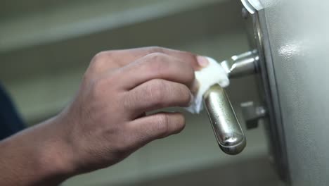 cleaning a metal door handle