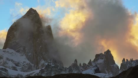 sunset over mount fitz roy with clouds glowing, showcasing jagged peaks in patagonia