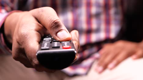 person using a tv remote