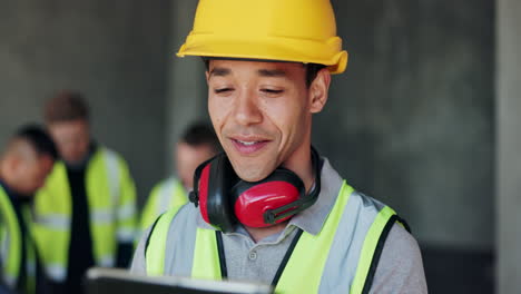 construction worker reviewing project on a tablet